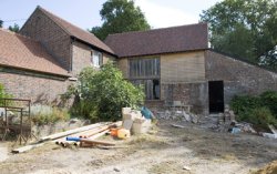 Sussex barn undergoing conversion with outbuildings, lake and tland near Buxted, East Sussex