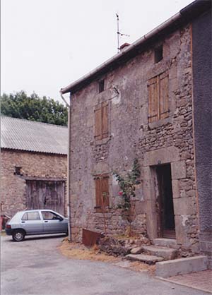 House and barn in courtyard setting in the Limousin region of France