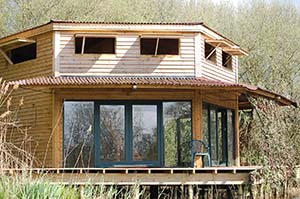 Timber lodge without land, dismantled and ready to be removed from present site