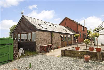 Powys farmhouse and unconverted barns