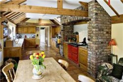 Former farmhouse, extended into two adjacent barns, in the village of Melbourne, near York, in Yorkshire