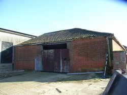 Unconverted barns with permission to convert into seven holiday accommodation units near Cromer
